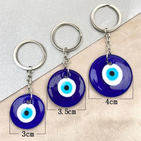 製品名: 青い邪眼キーホルダー 材料: Glass カラー: ブルー N w: 12-19g サイズ: 3 / 3.5 / 4cm 包装: 1個/オップバッグ 暖かいヒント: 写真のため、モニターによ